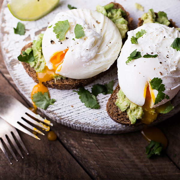 smashed avocado and poached eggs with feta toast